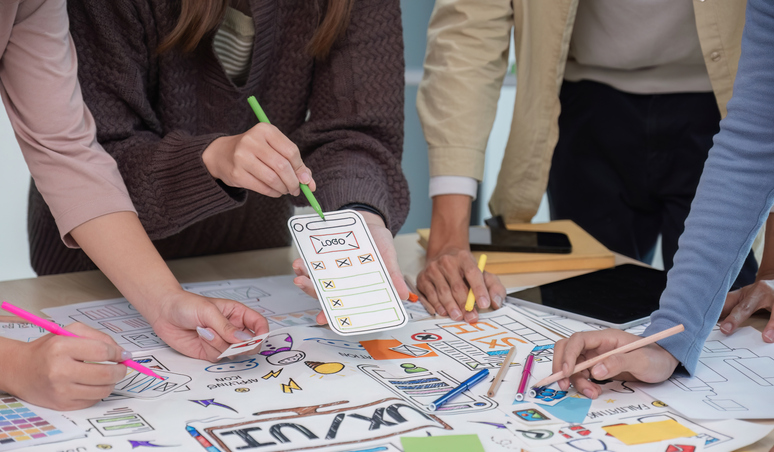 Brainstorming session for the creative team of designers in application design and implementation planning ux ui Teamwork of modern business teams